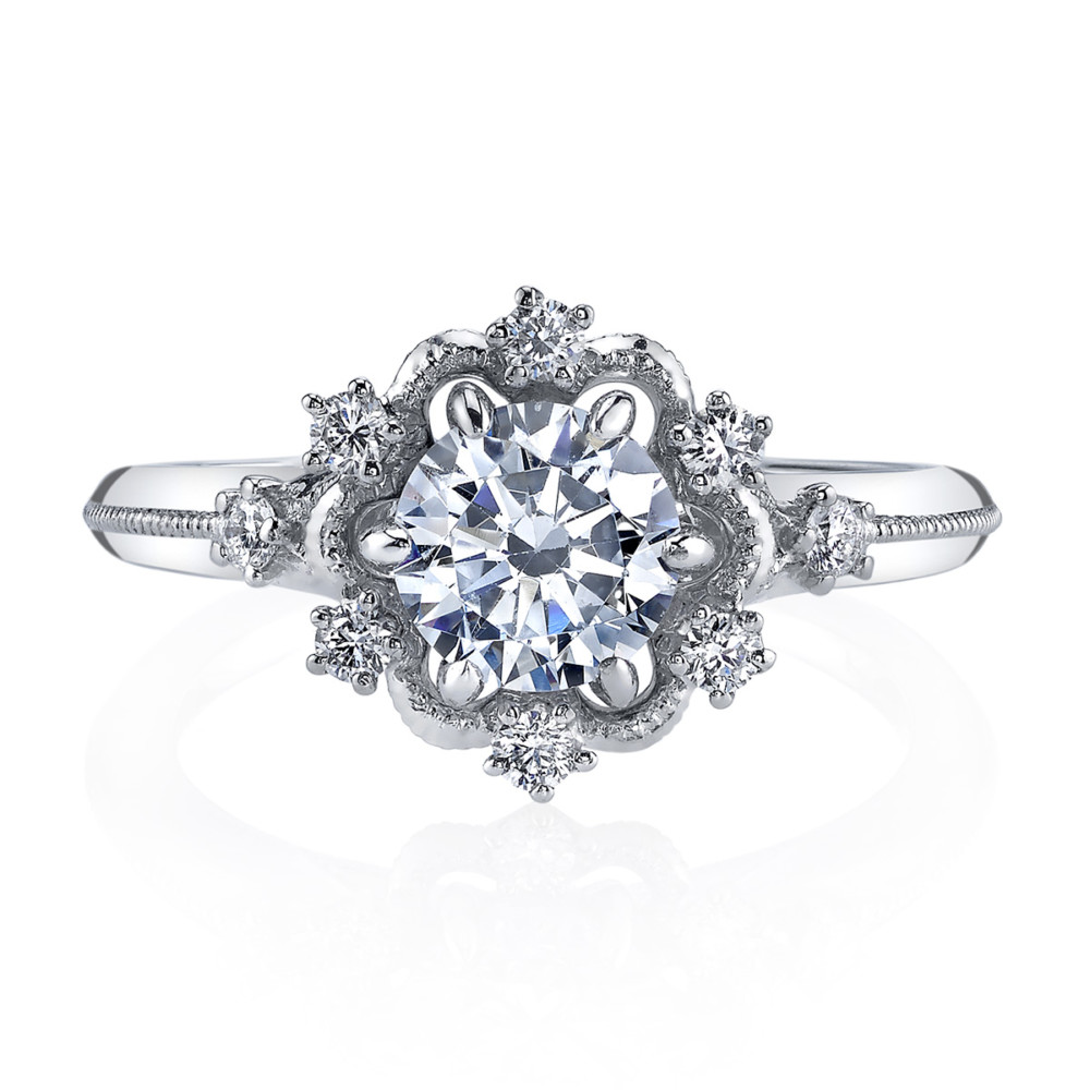 Vintage designer diamond halo engagement ring by Parade Design.